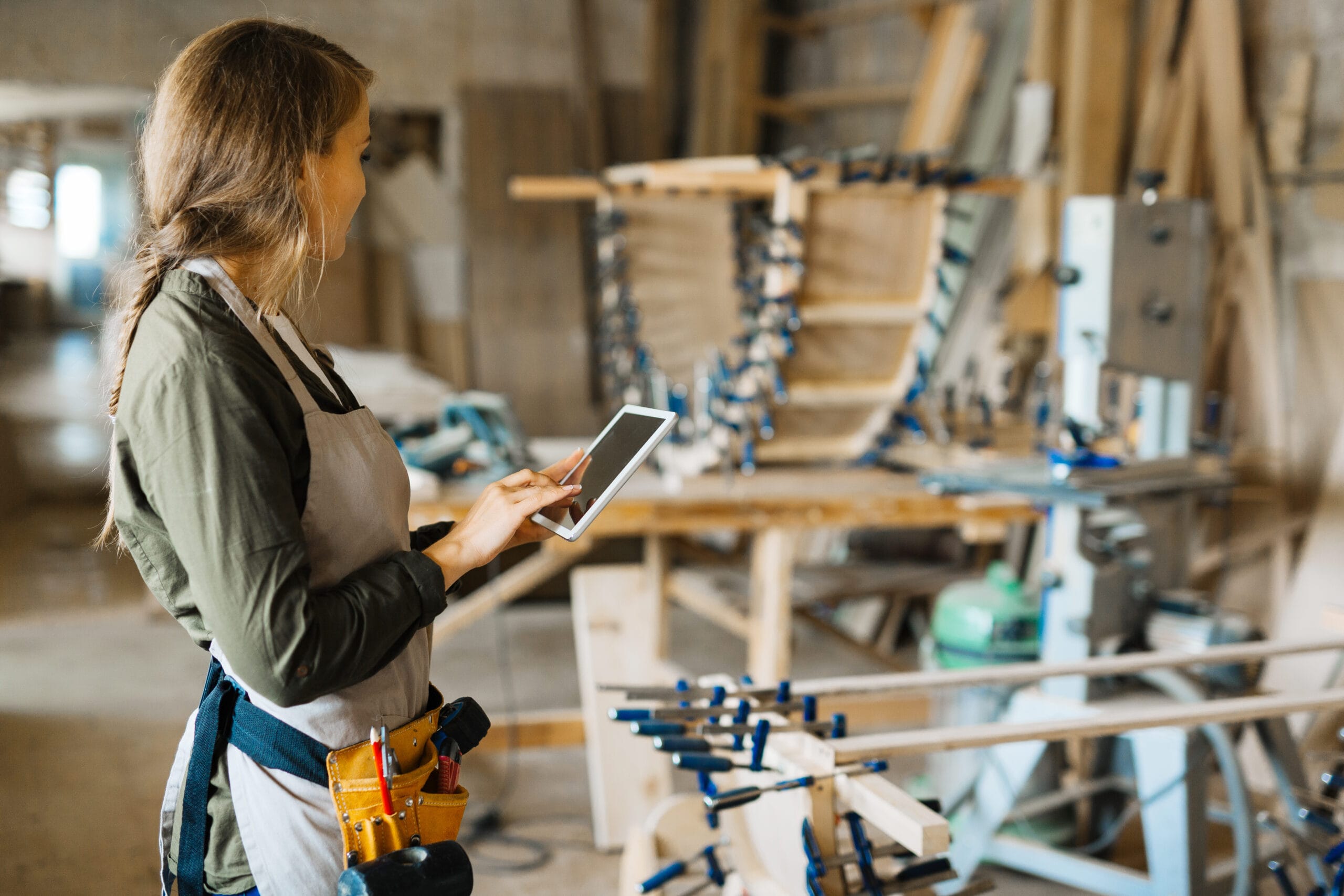 A plumber searching for necessary data in a workshop